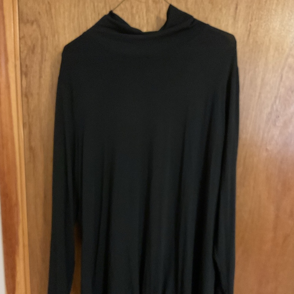 Long sleeve black mock turtleneck blouse with split side